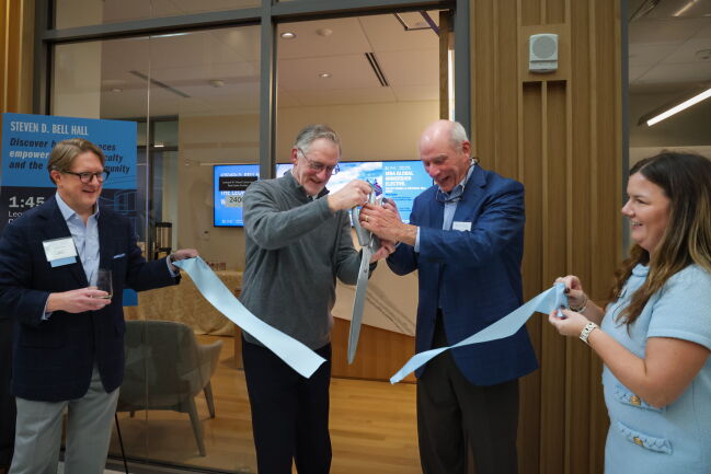 David Hartzell cuts the ribbon at the dedication for The Wood Center for Real Estate Studies.