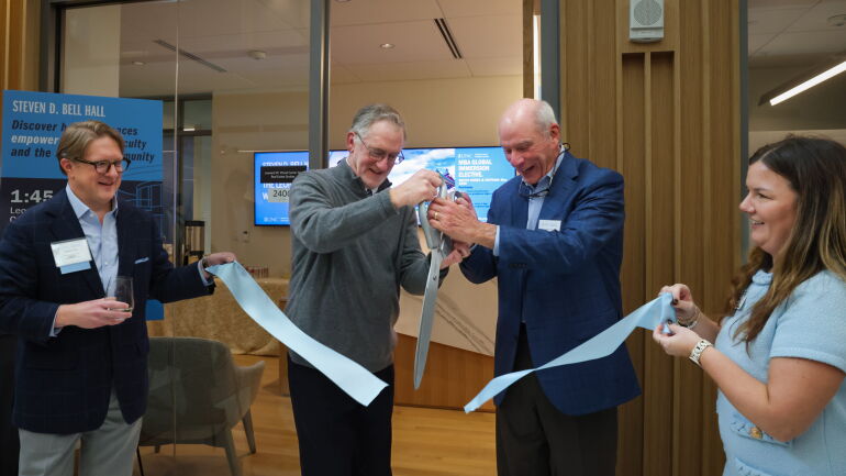 David Hartzell cuts the ribbon at the dedication for The Wood Center for Real Estate Studies.