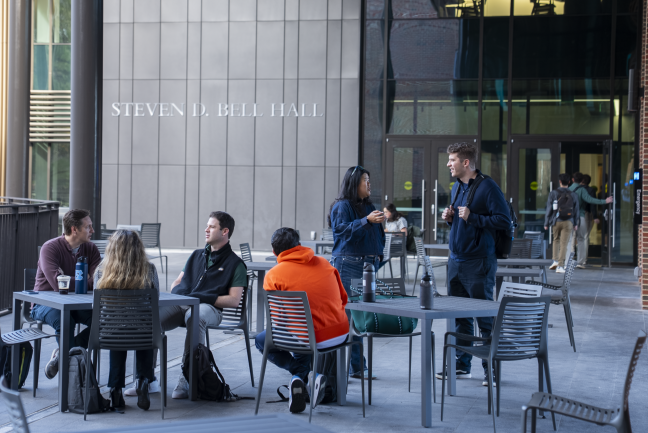 Students congregate on the bridge between McColl Building and Bell Hall.