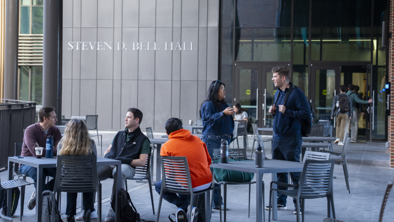 Students congregate on the bridge between McColl Building and Bell Hall.