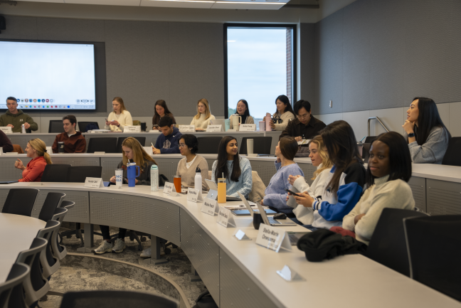 Students wait for class to begin in a Bell Hall classroom.