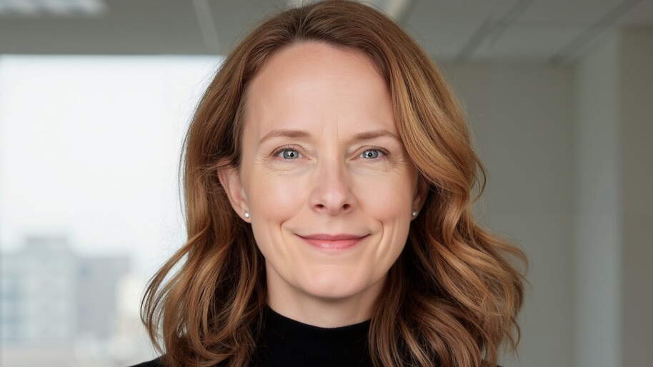 Rachael Tucker headshot, black sweater