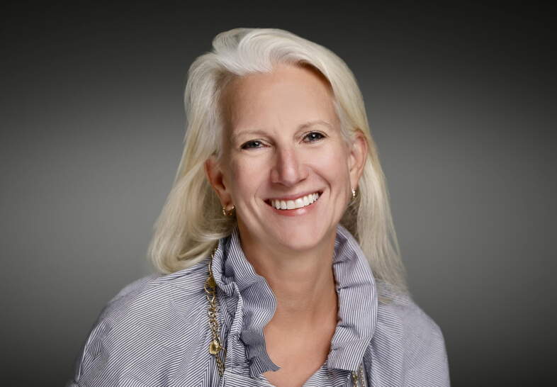 headshot of kit bredrup, smiling