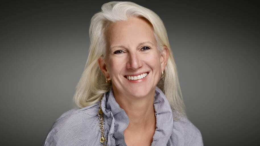 headshot of kit bredrup, smiling