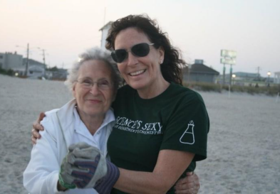 Bonnie and her mother hugging on beach