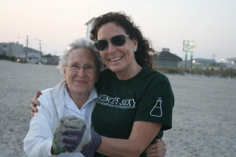Bonnie and her mother hugging on beach