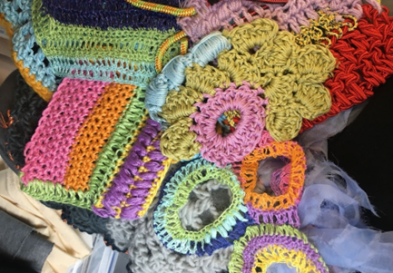 Colorful pieces of knit and crochet yarn