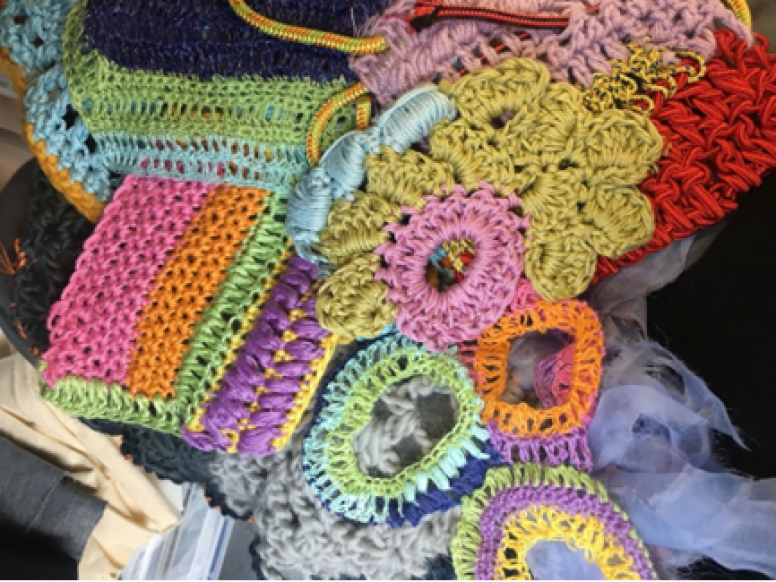 Colorful pieces of knit and crochet yarn