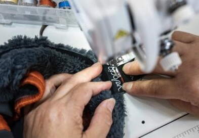 Hands working at sewing machine
