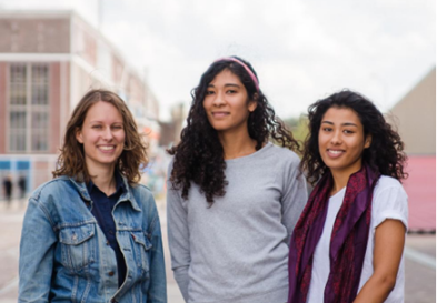 Noor, Marcella, and Melissa standing together smiling