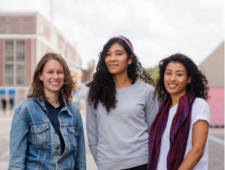 Noor, Marcella, and Melissa standing together smiling