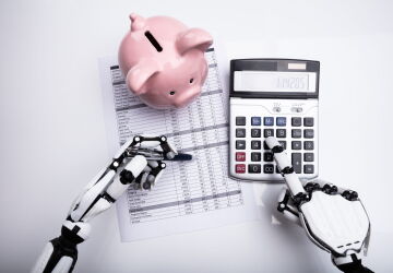 Close-up Of Robot Examining Financial Report With Calculator On Desk