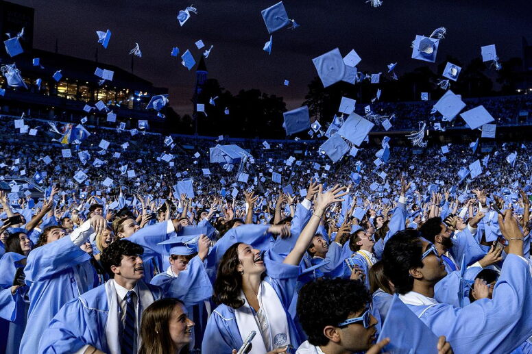 Carolina graduates throw their caps into the air at the spring 2026 commencement ceremony.