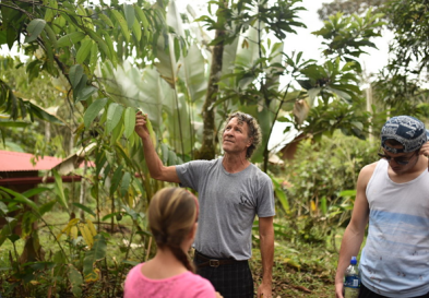 Tim O’Hara, founder of Rancho Mastatal, shows young students local plant species found on site. Via Rancho Mastatal