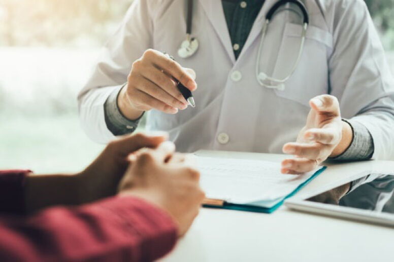 Doctor and patient talking with hands