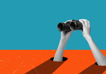 Hands holding binoculars on a blue/orange background