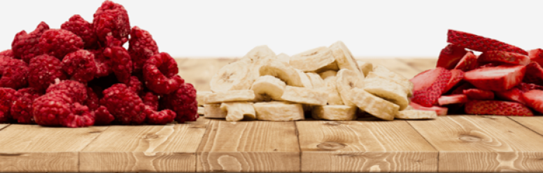 Sliced raspberries, bananas, and strawberries on a charcuterie board