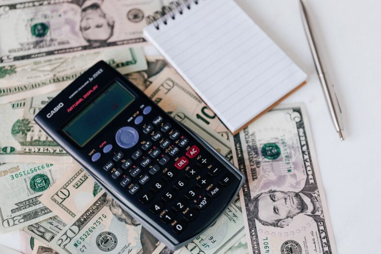 calculator, money, notepad, pen
