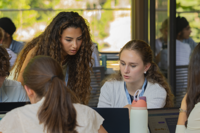 Peer leader helping a student at the Tar Heel Business Academy