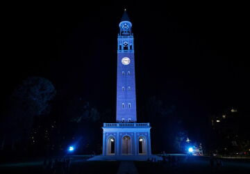The Bell Tower lit blue at night