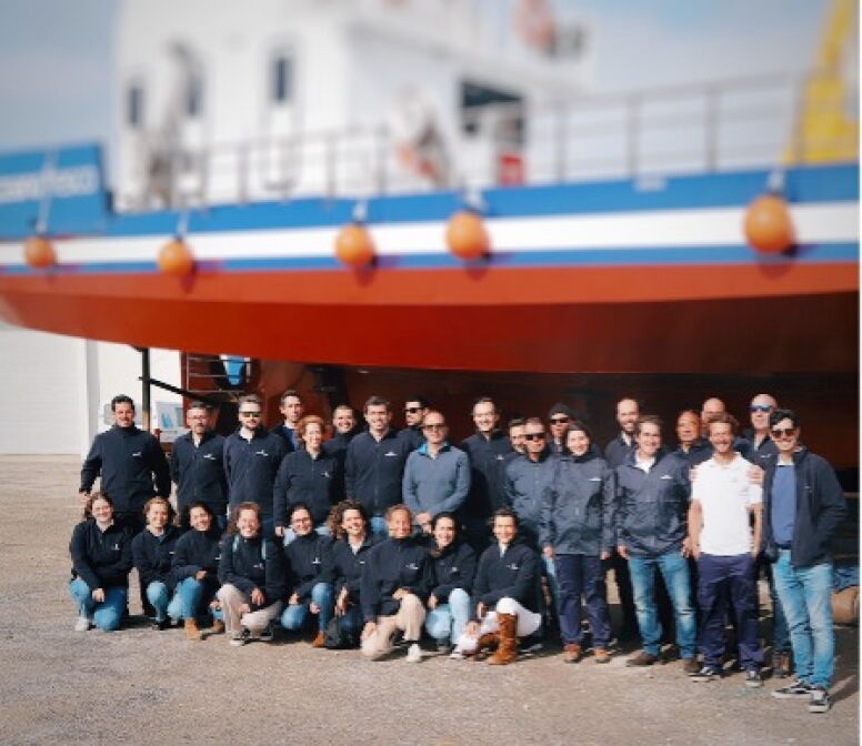 Oceano Fresco's team in front of boat.